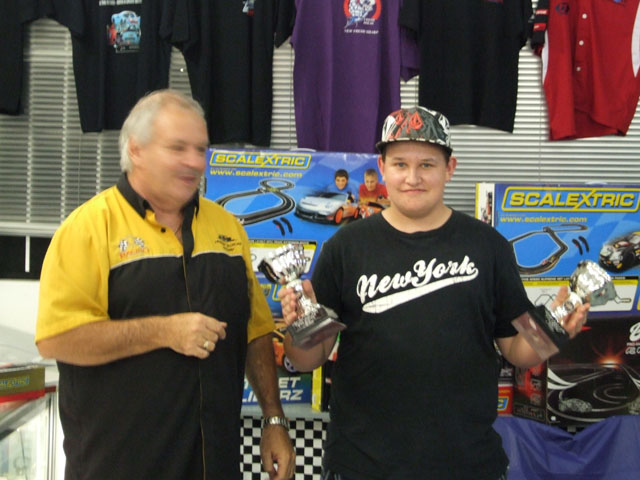 Mikey Batten, collecting the Winners 'Booty' ,..Hey!,..as They say,.."Where's Geoff?",..ROFL<br />Well Done Guys.